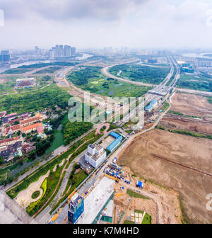 Royalty Free Stock Bild in hoher Qualität Luftaufnahme von Ho Chi Minh City, Vietnam. Schönheit Wolkenkratzer entlang des Flusses licht Smooth Down Stadtentwicklung Stockfoto