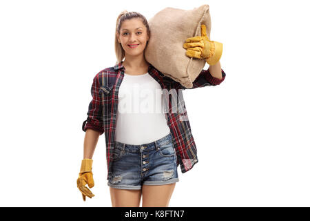 Weibliche Landwirt mit einem sackleinen Sack an der Kamera auf weißem Hintergrund suchen Stockfoto