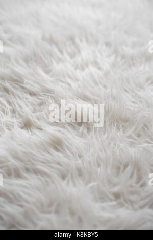 Foto von einem Schaffell wolle Teppich closeup für Hintergrund (selektive Fokus) Stockfoto
