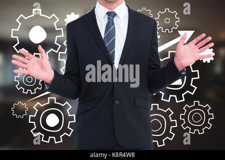 Digital composite Business Mann gegen Menschen in den Herstellungskosten Grafiken gegen Büro Hintergrund Stockfoto