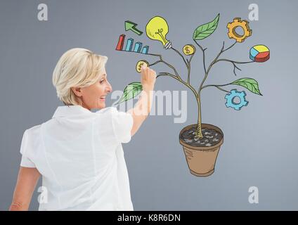 Digital composite von Frau mit Stift und Erstellung von Geschäftsgrafiken auf die Zweige an der Wand Stockfoto