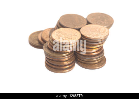 Einsparungen, die Spalten der Münzen auf Weiß isoliert Stockfoto