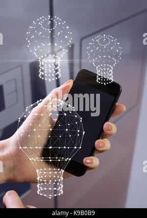 Digital composite von Hand mit Telefon mit Glühlampe Stecker Stockfoto