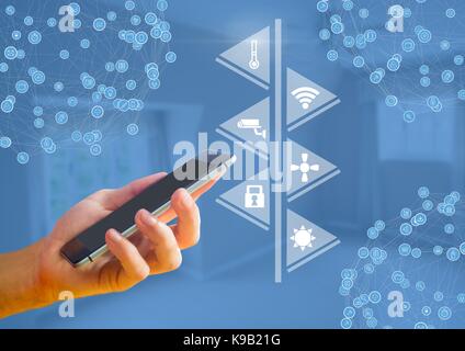 Digital composite von Hand mit Telefon mit smart home Schnittstelle und Anschlüsse Stockfoto