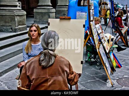 Street artist in Florenz, Italien, Zeichnung einer jungen Frau an der Uffizien Piazzale Stockfoto