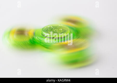 Nahaufnahme der Lime Green fidget Spinnen Spinner Stockfoto