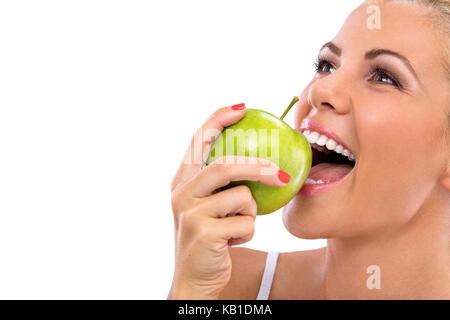 Frau essen, grüner Apfel, Beißen, Apfel mit perfekte Zähne Stockfoto