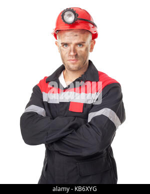 Porträt von Ernst coal Miner mit verschränkten Armen auf weißem Hintergrund Stockfoto