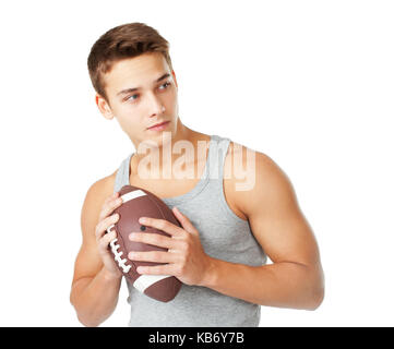 Portrait des jungen Mannes Holding rugby ball auf weißem Hintergrund Stockfoto