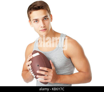 Portrait des jungen Mannes Holding rugby ball auf weißem Hintergrund Stockfoto