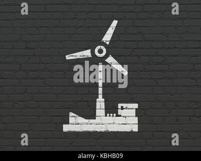 Manufacuring Konzept: Windmühle auf Wand Hintergrund Stockfoto