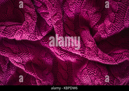 Rosa Strickpullover Textur Hintergrund, zerknitterte Pullover Stockfoto