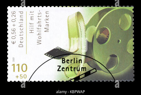 Von Deutschland ausgedruckte Briefmarke, die den Filmprojektor zeigt. Stockfoto