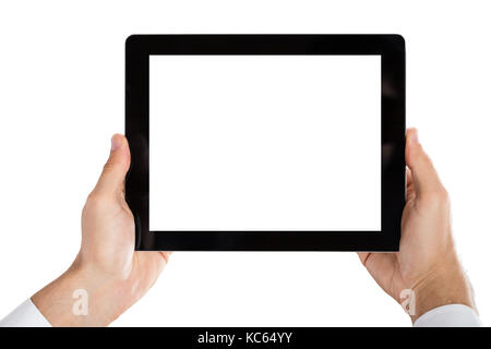 In der Nähe von des Menschen Hand Digital Tablet auf weißem Hintergrund Stockfoto