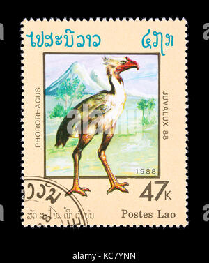 Briefmarke aus Laos mit der Darstellung eines Phorusrhacos Stockfoto