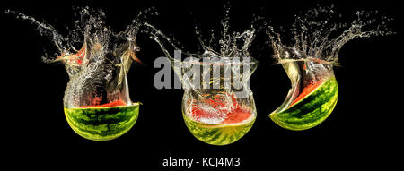 Frische Melone in Wasser fallen Stockfoto