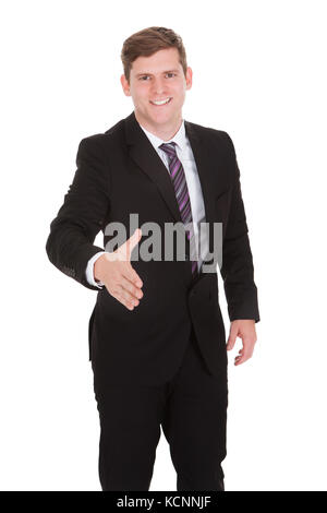 Happy Geschäftsmann mit Handshake auf weißem Hintergrund Stockfoto