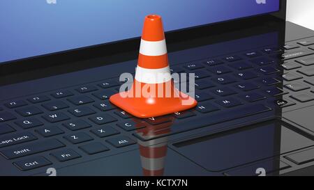 Orange Leitkegel auf schwarzer Laptop Tastatur Stockfoto
