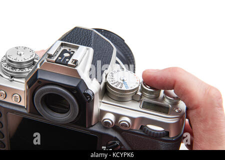 Im Retrostil digitale SLR-Kamera in den Händen des Fotografen isoliert Stockfoto
