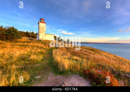 Sunrise, quaco Head Lighthouse, Bucht von Fundy, New Brunswick Kanada Stockfoto