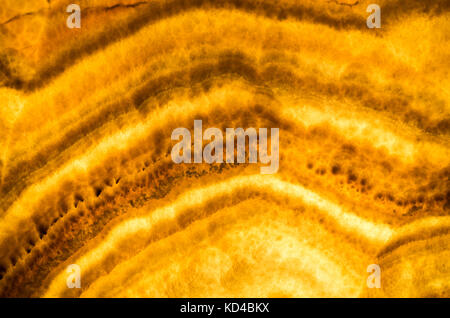 Honey Onyx, dekorative stone wall Panel, closeup Hintergrund Foto Textur Stockfoto