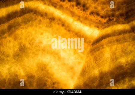 Honey Onyx, dekorative stone wall Panel, Nahaufnahme Hintergrund Foto Textur Stockfoto