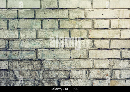 Verwitterte weiße Mauer Oberflächenstruktur mit Flecken und Kratzer Stockfoto