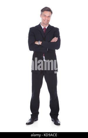 Portrait von zuversichtlich reife Geschäftsmann mit Arm gekreuzt Stockfoto