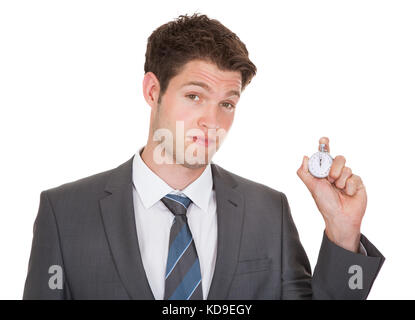 Junge Unternehmer Halten Sie Stoppuhr auf weißem Hintergrund Stockfoto