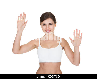Porträt von gesunden Frau den Bildschirm mit dem Finger auf weißem Hintergrund Stockfoto