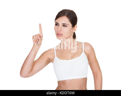 Porträt von gesunden Frau den Bildschirm mit dem Finger auf weißem Hintergrund Stockfoto