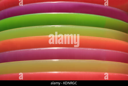 Piled up colorful plastic plates, Abstract Background Stockfoto