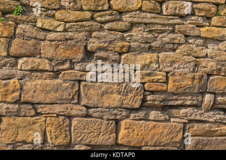 Verwitterte Alte Steinwand Hintergrund Stockfoto