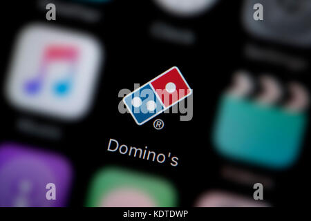 Eine Nahaufnahme des Logo für Pizza App das Symbol des Domino, wie auf dem Bildschirm eines Smartphones (nur redaktionelle Nutzung)