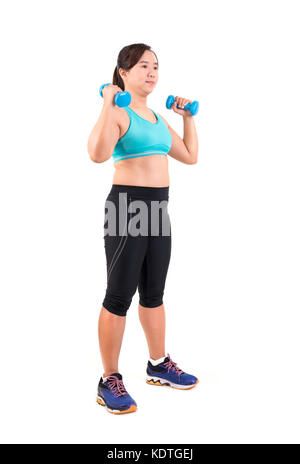Asiatische chubby woman holding Hantel für die Ausübung Stockfoto