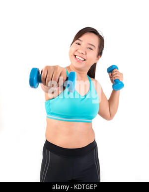 Asiatische chubby woman holding Hantel für die Ausübung Stockfoto