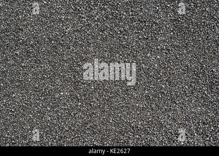 Schwarzer Sand Messwerteblock hautnah. Hintergrund und Textur Stockfoto