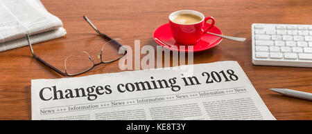 Eine Zeitung auf einem hölzernen Schreibtisch - Änderungen im Jahr 2018 kommen Stockfoto