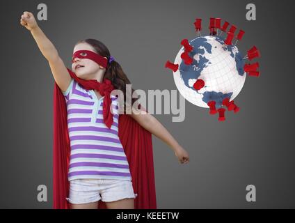 Digital composite von Mädchen gegen grauen Hintergrund mit Superhelden Kostüm und Weltkugel mit Paßstifte Stockfoto