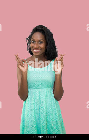 Frau mit gekreuzten Fingern Stockfoto