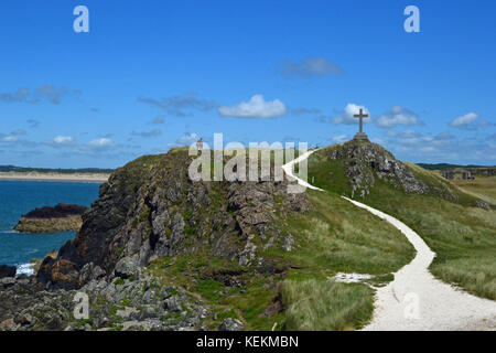 Christliche kreuz Denkmal auf llanddwyn Island, Anglesey, Wales Stockfoto