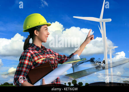 Portrait Frauen Asien Ingenieur arbeiten und halten Blueprints auf Wind Turbine farm Power Generator, Double Exposure Stockfoto