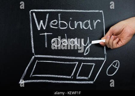 Person hand Übersicht webinar Konzept auf der Tafel Stockfoto