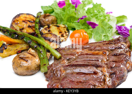 Rindersteak mit Kartoffeln und grünen Stockfoto