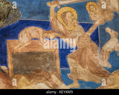 Durch die Bindung von Isaac bittet Gott Abraham, seinen Sohn Isaac zu opfern, aber er wird von einem Engel verhindert. Ein romanisches Wandgemälde in der Kirche Bjaresjo, Schweden, nein Stockfoto