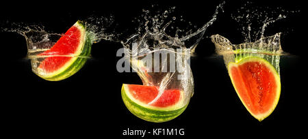 Frische Melone in Wasser fallen Stockfoto