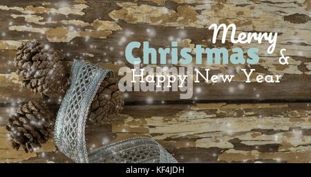 Digital composite Der frohe Weihnachten und ein glückliches neues Jahr text auf Weihnachten Hintergrund mit Schnee Stockfoto