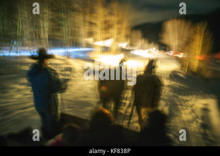 Usa, Colorado, Aspen, Wrangler Ali fährt Gäste in einer Pferdeschlittenfahrt am Pine Creek wade Lodge Stockfoto