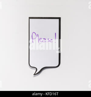 Eine weiße Memo Pad mit der Form eines Comics mit der Aufschrift "bitte" Stockfoto