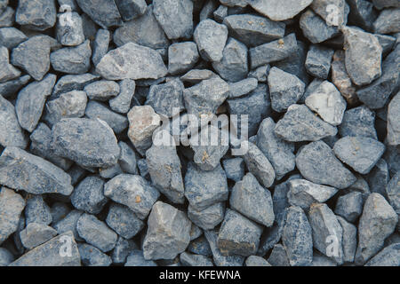 Nahaufnahme der grauen Gestein, Stein Rohstoff für die Bauindustrie. Hintergrund und Textur. Stockfoto